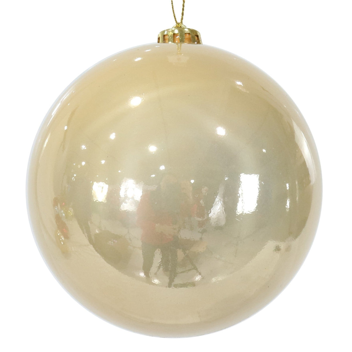 Gold Christmas ball ornament on a white background
