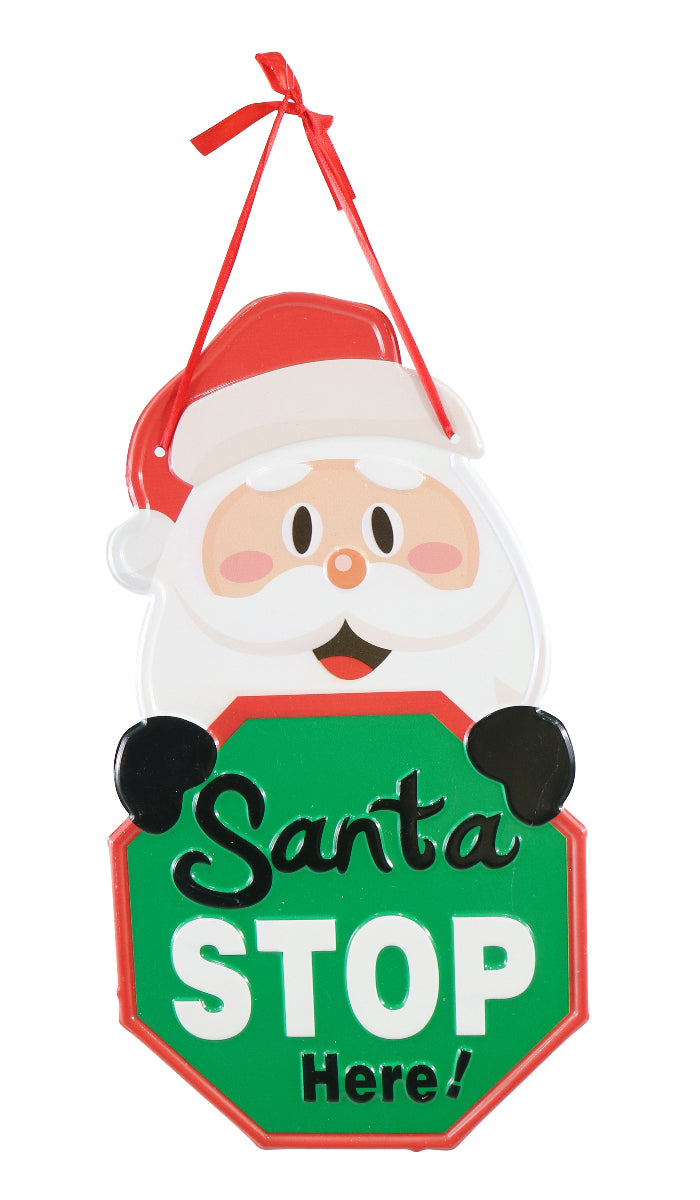 Decorative sign with a cartoon Santa face and 'Santa Stop Here!' text on a white background